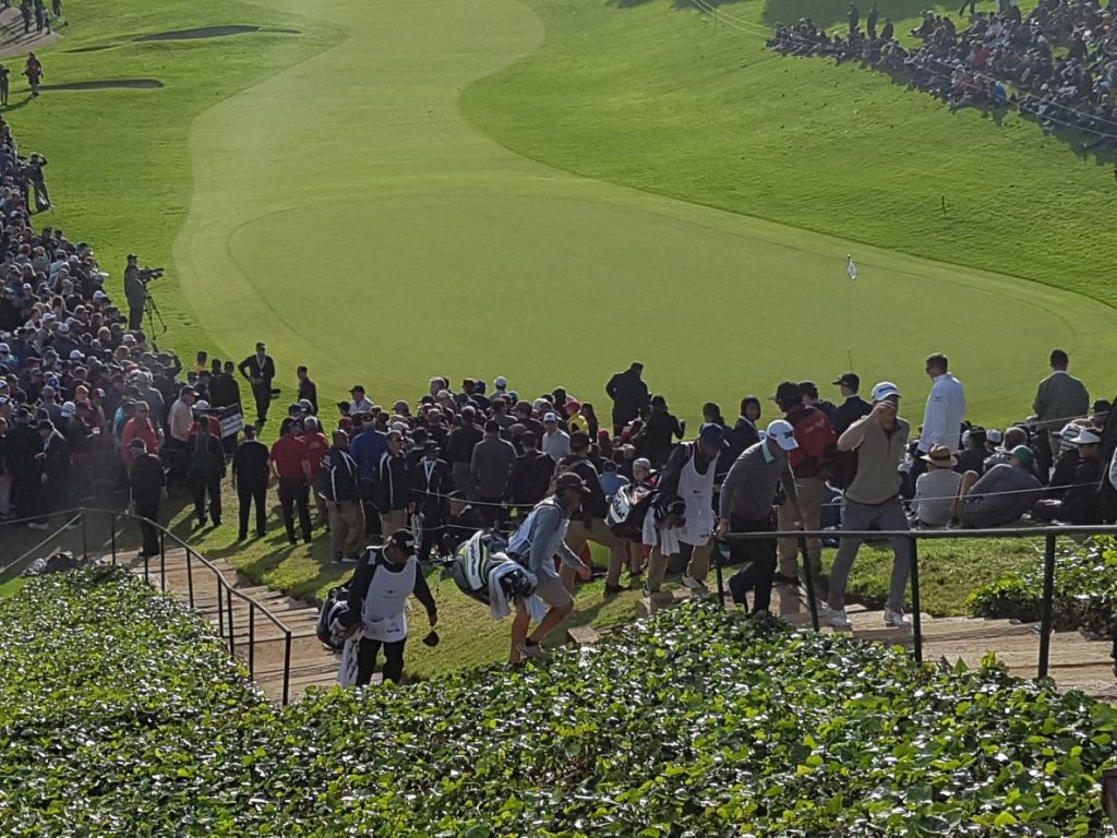 Martrin Laird climbs the stairs at the back of Riviera's 18th and heading for the scorer's room.