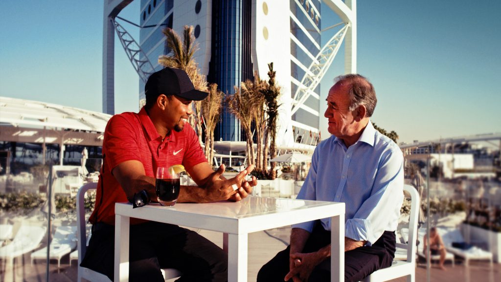 Tiger Woods chats with former R & A CEO Peter Dawson