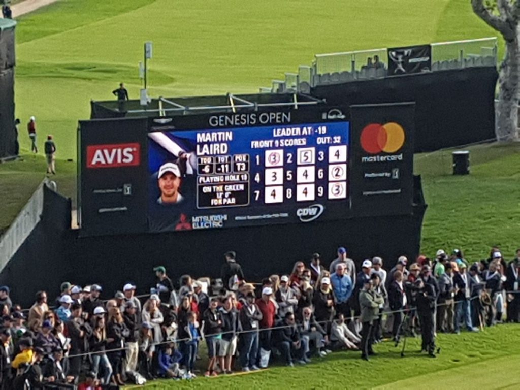 The electronic scoreboard shows Martin Laird T3rd ahead of his 12-foot putt for par at the 72nd hole.