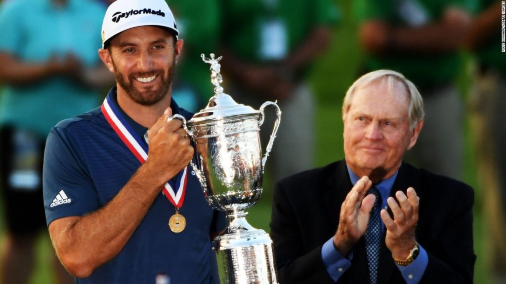 Dustin Johnson lifts the US Open trophy despite the controversy that engulfed the final round of the 2016 US Open. (Photo - USGA)